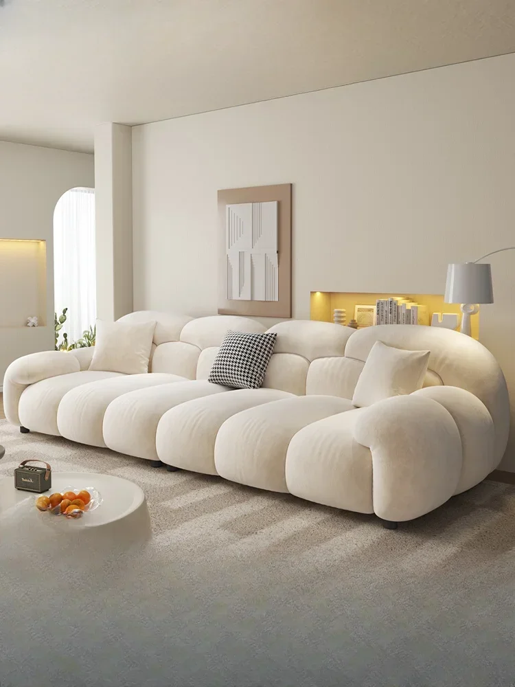 

Cream wind cloud sofa living room small apartment straight row simple Internet celebrity Foshan furniture 2024 new fabric sofa