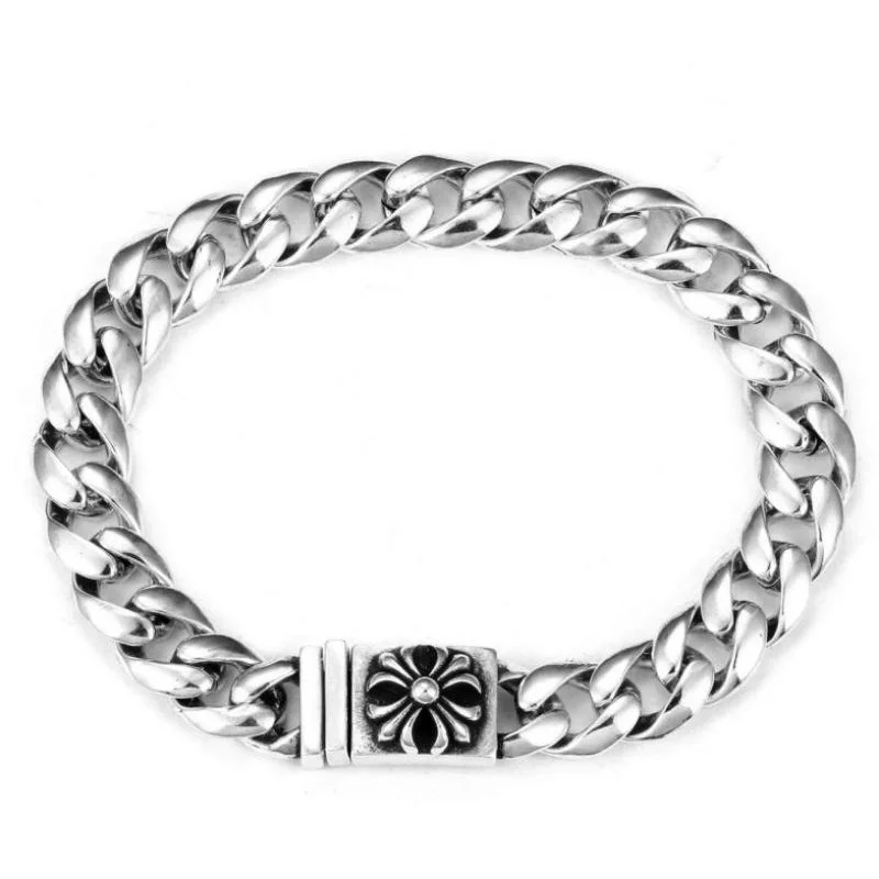 

Polished Silver Cuban Link Bracelet with Cross Flower Accent: Sleek Statement Jewelry