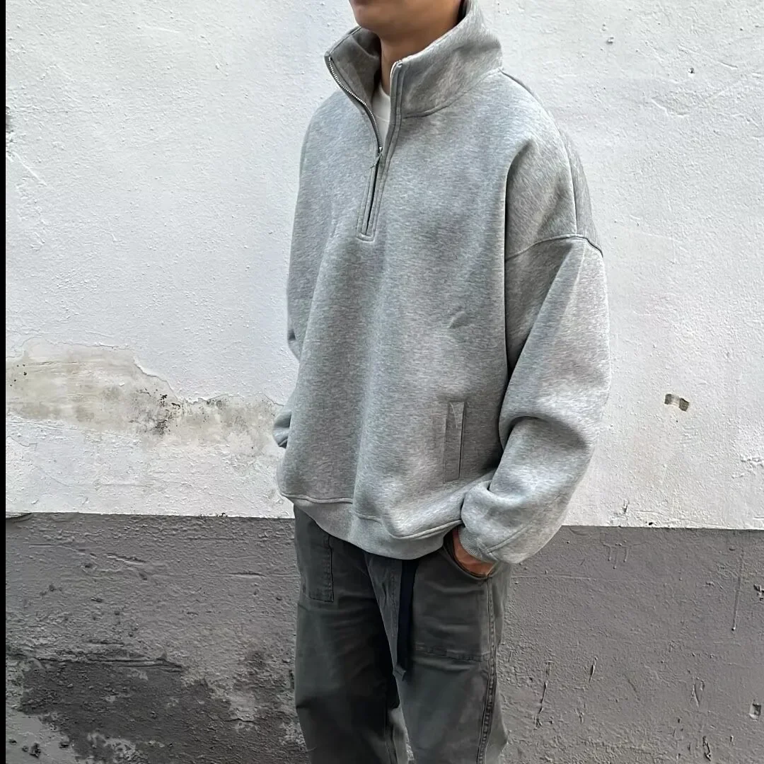 Felpa con mezza zip stile americano da uomo all'inizio della primavera Casual tinta unita giacca con colletto alla coreana vestibilità ampia abbigliamento Oversize da uomo