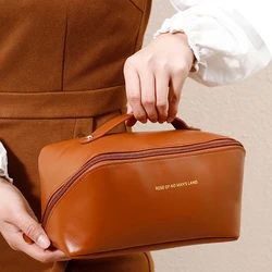 Borsa da viaggio portatile multifunzionale in pelle PU con borsa per il trucco del cuscino dell'organo di stoccaggio di grande capacità