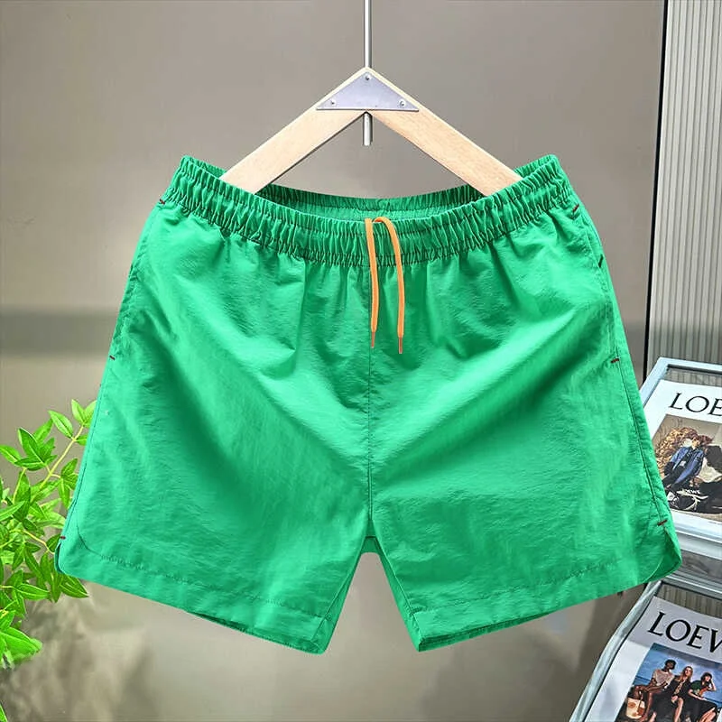 

Мужские спортивные шорты из ледяного шелка: летние, легкие, свободные, быстросохнущие, повседневные пляжные брюки, модные, длиной три четверти, для активного отдыха