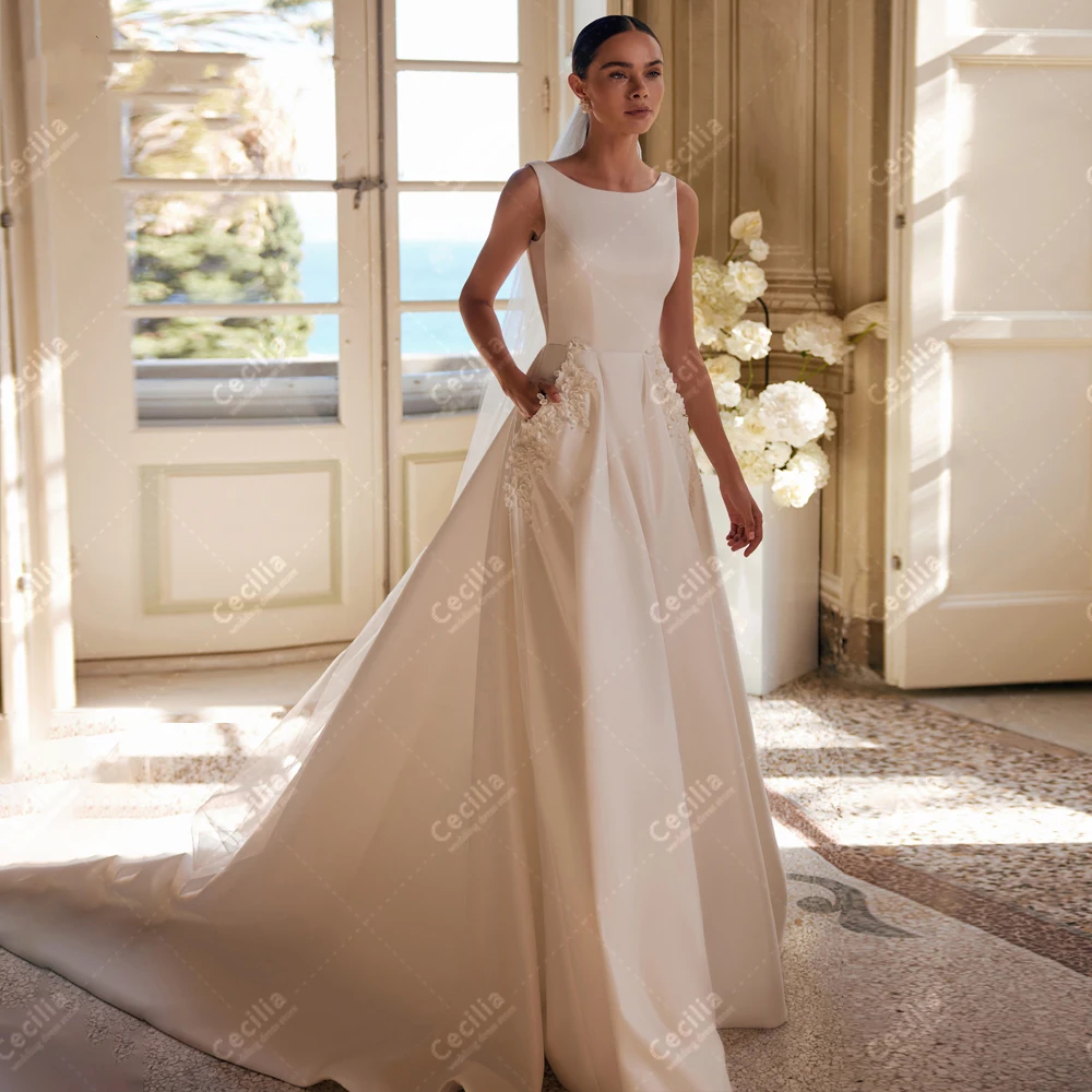 

Charming Wedding Dresses With Pockets A-Line Satin Bridal Gowns Sleeveless Backless Robes O-Neck Vintage Vestidos De Novia 2024