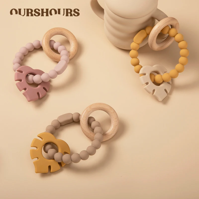 

Baby Silicone Teether Wooden Ring Teething Toy Rattles Bracelet BPA Free Leaves Shape Infant Chewing Toys Babies Accessories