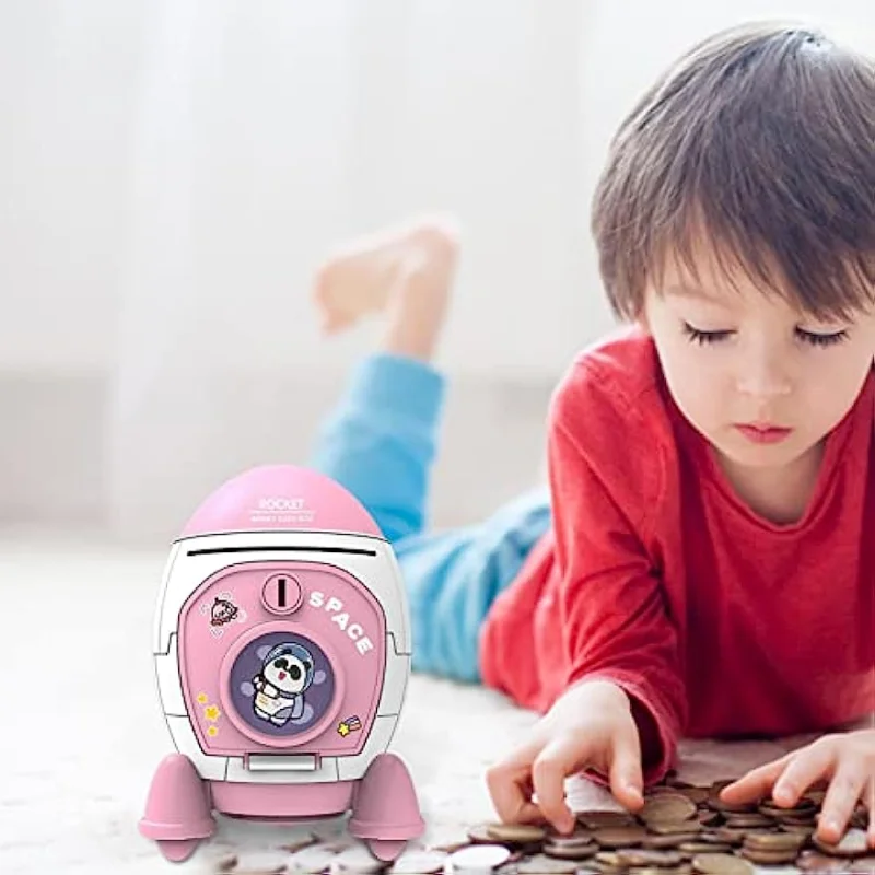 Rocket Ship Piggy Bank للفتيات، آمن للمال، عملة نقدية لرائد الفضاء، يمكن بنك ATM مع ملصق مفاتيح، هدية عيد الميلاد للأطفال