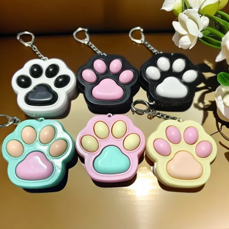 新しい創造的な人格ストレスリリーフおもちゃかわいい猫の足キーボードキーチェーンペンダントカップルバッグペンダントおもちゃギフト