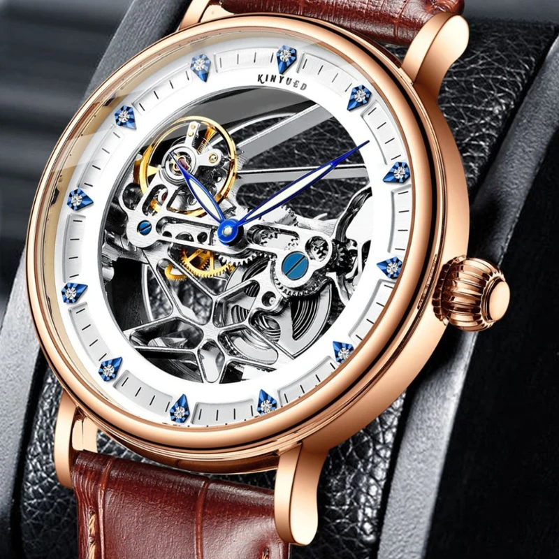 KINYUED العلامة التجارية الجديدة الفاخرة تصميم جوفاء الهيكل العظمي ساعة ميكانيكية للرجال حزام من الجلد مقاوم للماء موضة ساعات أوتوماتيكية رجالي