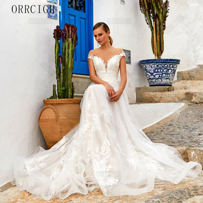 Exquisite Lace Applique Tulle Wedding Dresses Sheer Neck Sweep Train Backless Short Sleeve Customizable Bridal Gown 2026