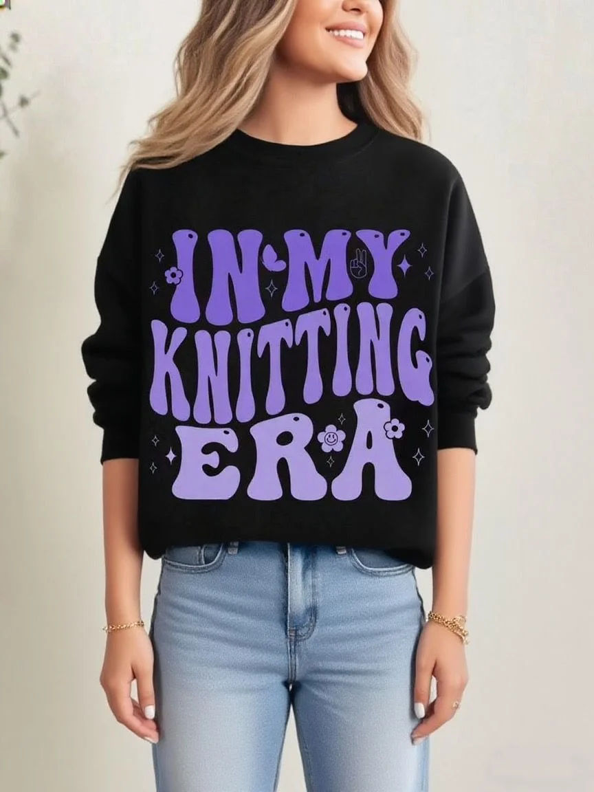 Zwart los sweatshirt met ronde hals en leuke "IN MY KNITTING ERA" letterprint