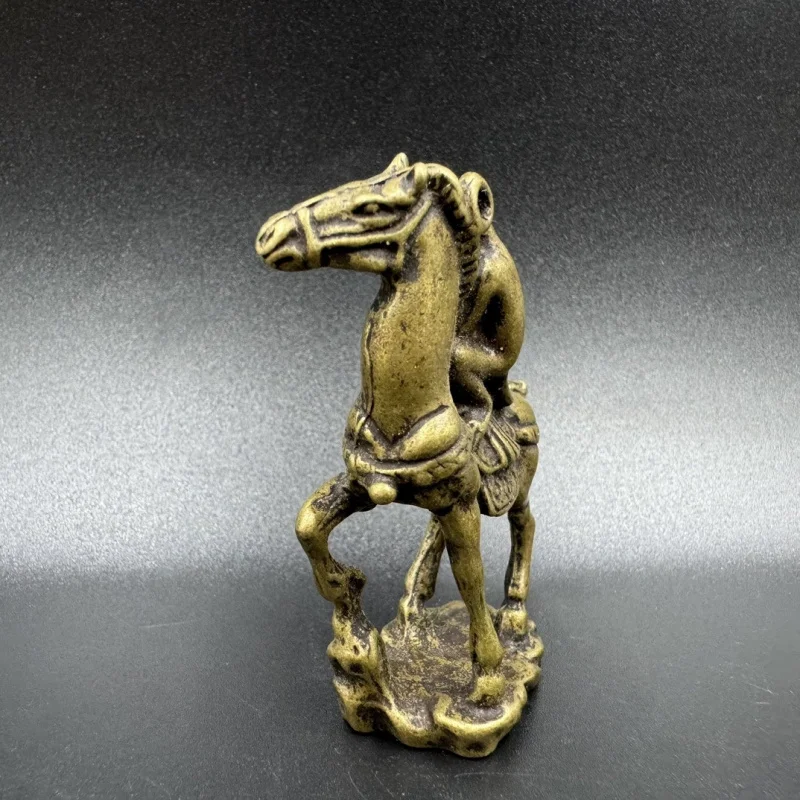 Small ornaments: standing, little, bronze monkey riding a horse, collectible items