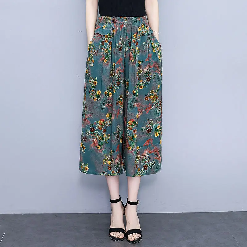 高齢者の女性の夏の新綿シルクフラワーパンツ女性の 7 分ワイドレッグパンツ弾性ハイウエストルーズスカートパンツ