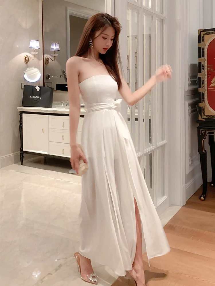 Seksowny biały kombinezon na ramiączkach 2025 Nowy Ele Lady High-End Super Fairy Spodnie z szerokimi nogawkami z rozcięciem, wysoki stan, długie spodnie, model wyszczuplający