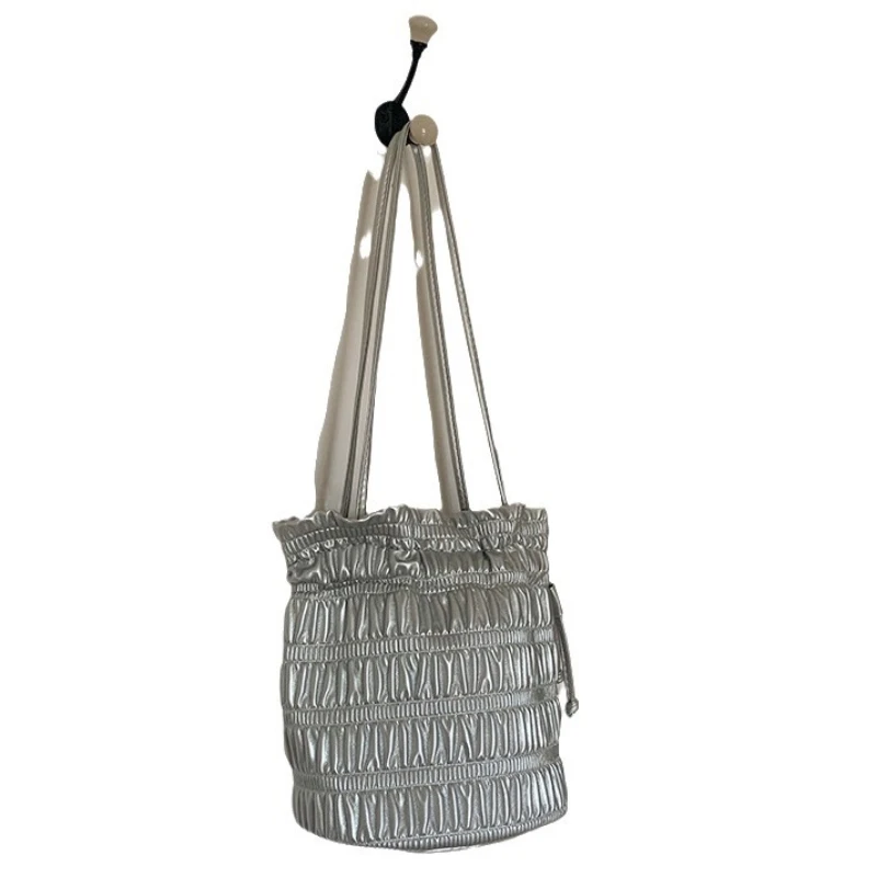 

Korean niche design gentle soft leather pleated drawstring bucket bag, single shoulder fashionable texture silver underarm bag