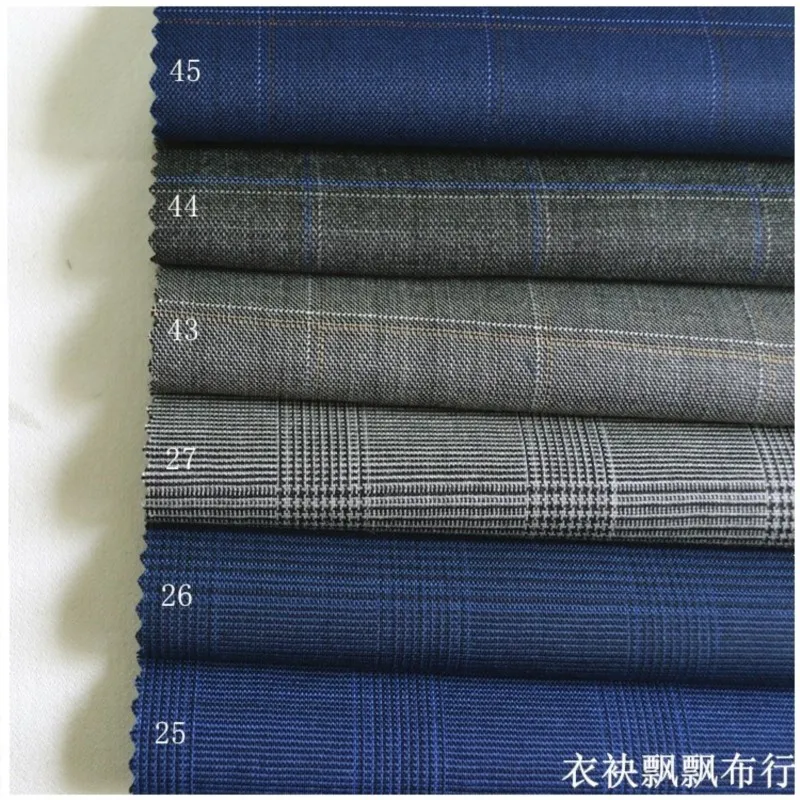 The fabric of suit is fine-spun blue deep medium wool which used for trousers and skirts