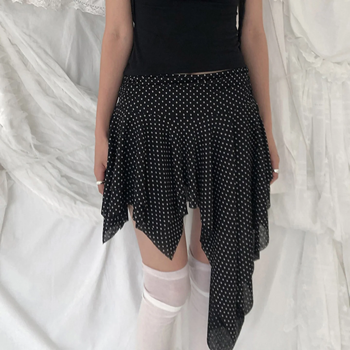 Europe and the United States dark polka-dot printed low-waisted skirt sexy slim mesh stitching irregular skirt in summer.