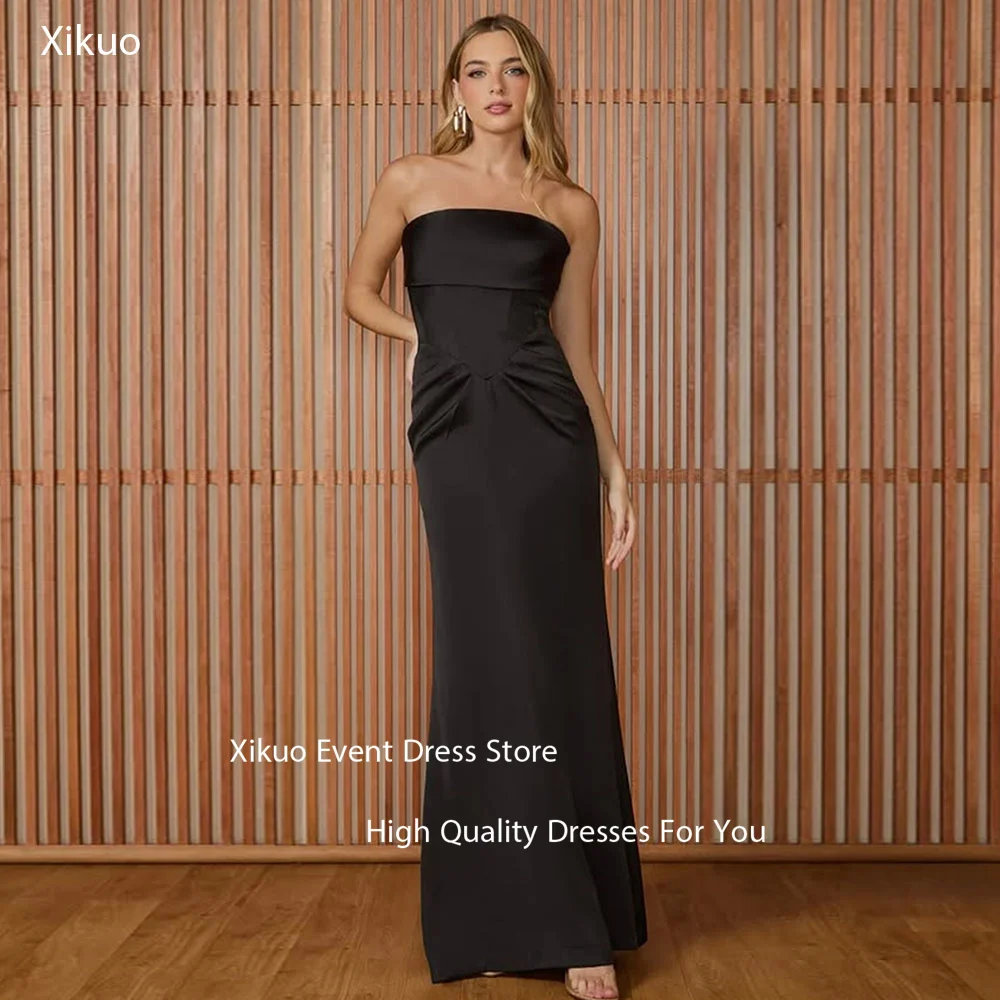 فساتين سهرة Xikuo بدون أكمام من الساتان الأسود بطيات مستقيمة بدون حمالات رداء De Soirée فساتين لحضور الحفلات الموسيقية الطويلة الرائعة حسب الطلب