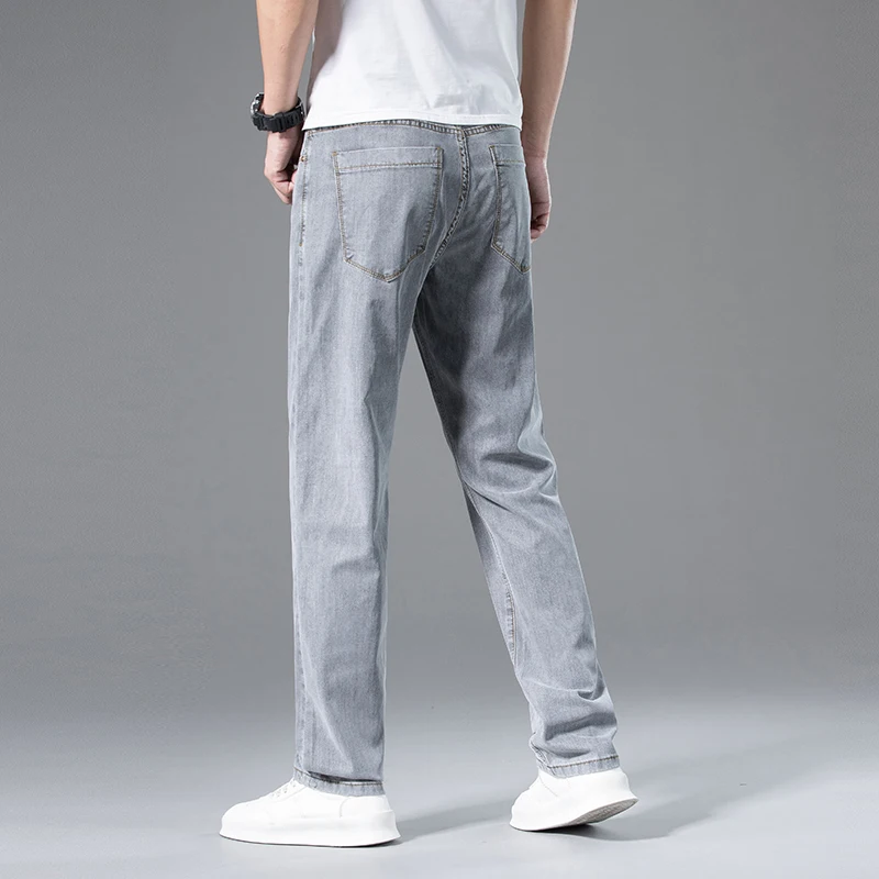 Jeans Lyocell da uomo ultrasottili estivi pantaloni Casual da lavoro dritti larghi pantaloni in Denim di marca grigio fumo con drappeggio morbido