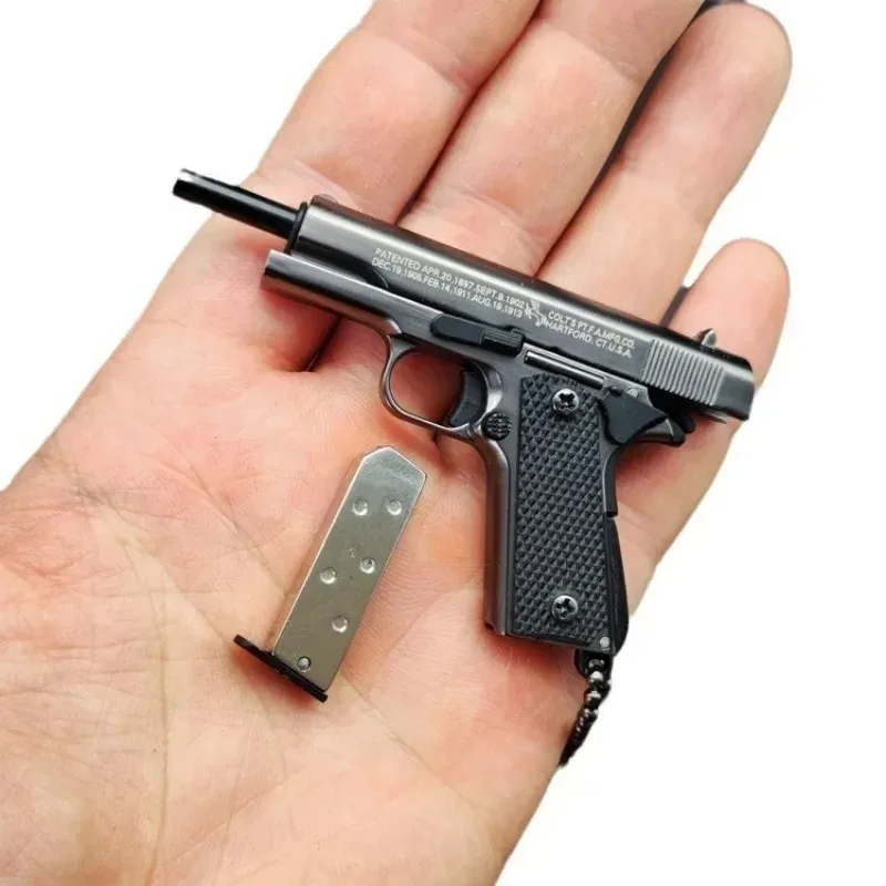 1:3 โลหะทอง M1911 Colt ของเล่นโลหะผสมปืนประดิษฐ์ MINI พวงกุญแจดูจริงคอลเลกชัน PROP วันเกิดแขวนของขวัญ