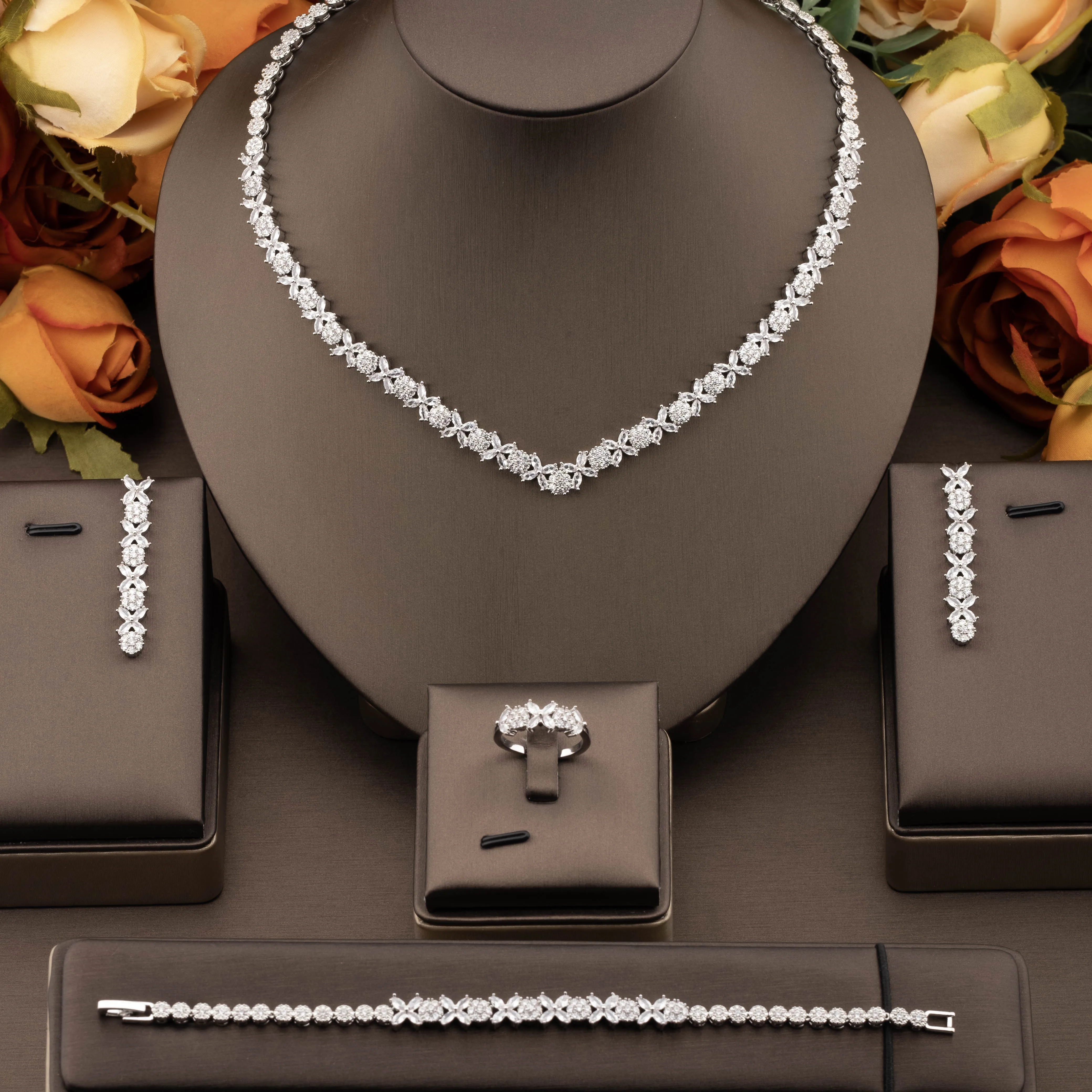 1 set of luxurious and elegant jewelry set with sparkling cubic zirconia and small clover design, suitable for women to wear at weddings and banquets. Gift box not included