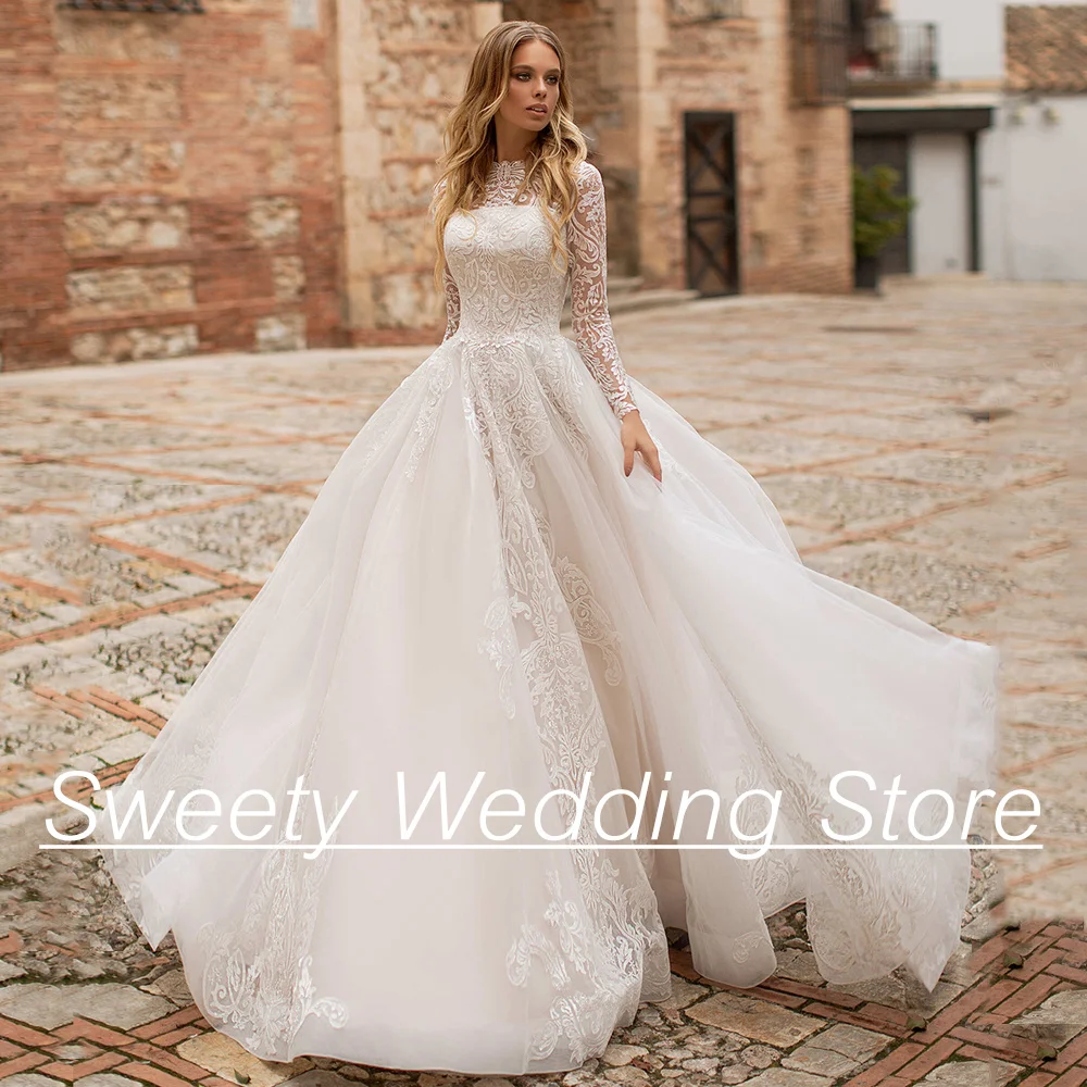 Gorgeous Ball Gown Wedding Dresses Jewel Neck Long Sleeve Lace Applique Sweep Train Tulle Bridal Gown For Woman Bride Dresses