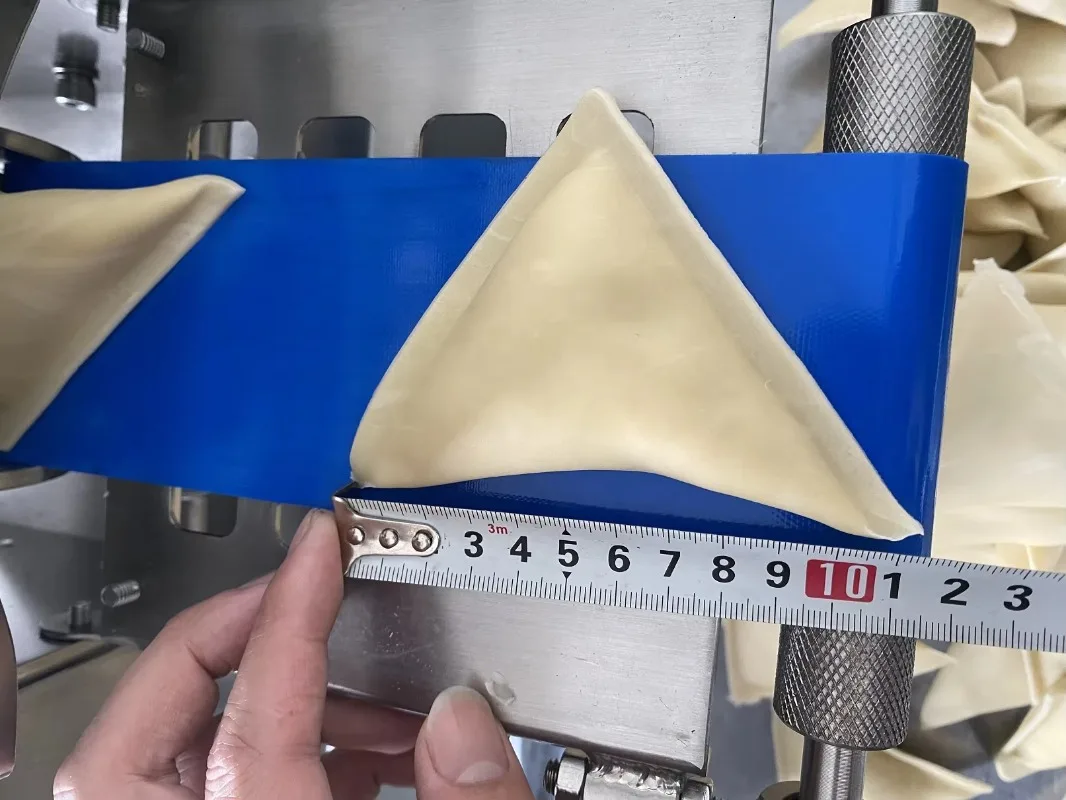 Picture 7: factory direct supply automatic samosa roti maker chapati making pastry machine pakistan india samosa making machine low price