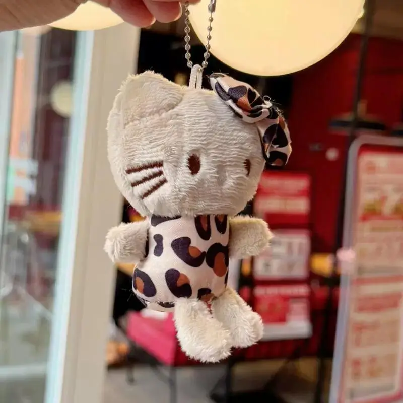 2025 nouveau Hello Kitty imprimé léopard en peluche porte-clés Sanrio créatif arc en peluche poupée fille sac à dos pendentif fermeture éclair accessoires jouets