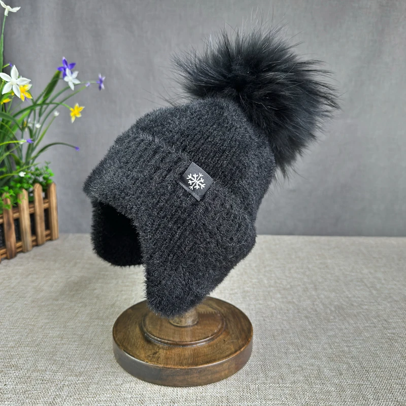 2024 nuova protezione per le orecchie cappello invernale da donna cappello di lana con pompon in pelliccia di procione naturale cappello pullover di visone cappello invernale lavorato a maglia spesso berretti