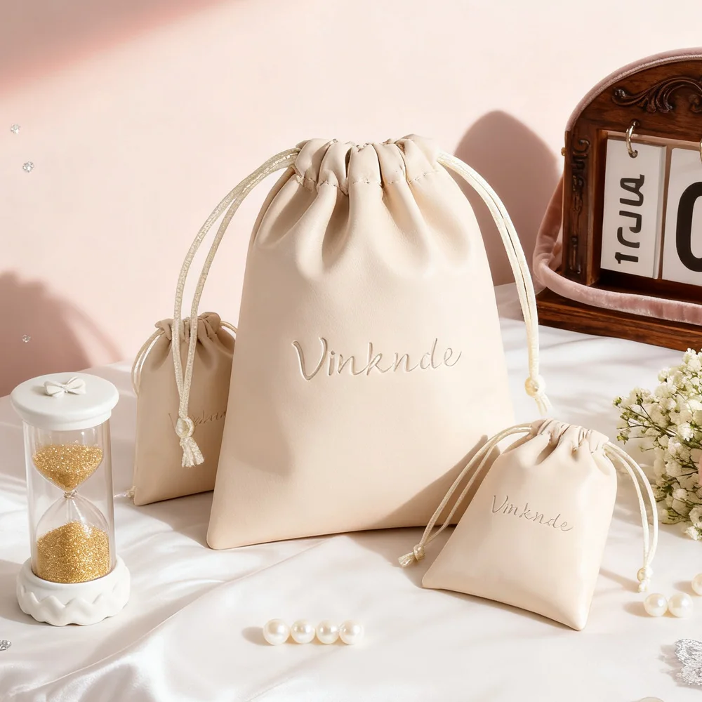 

50Pack Custom Logo Printed Beige Drawstring Pu Leather Bag Makeup Power Bank Packaging Bags Waterproof Cosmetic Wedding Pouch