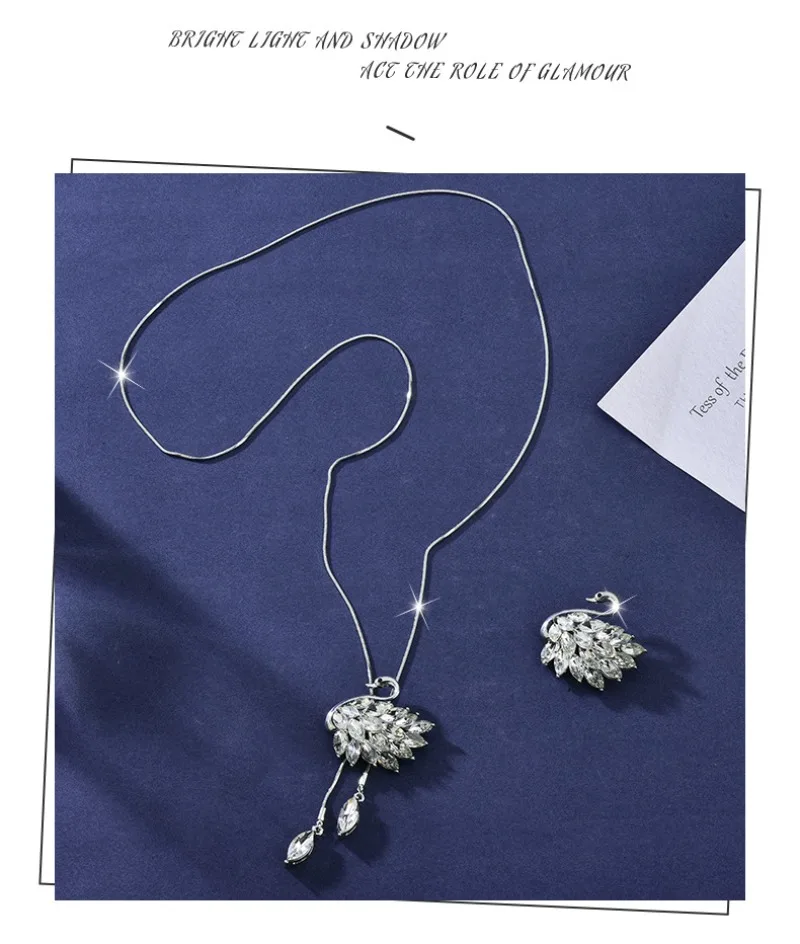 

A long crystal swan necklace with two pieces for autumn and winter, a fashionable and versatile sweater chain for women