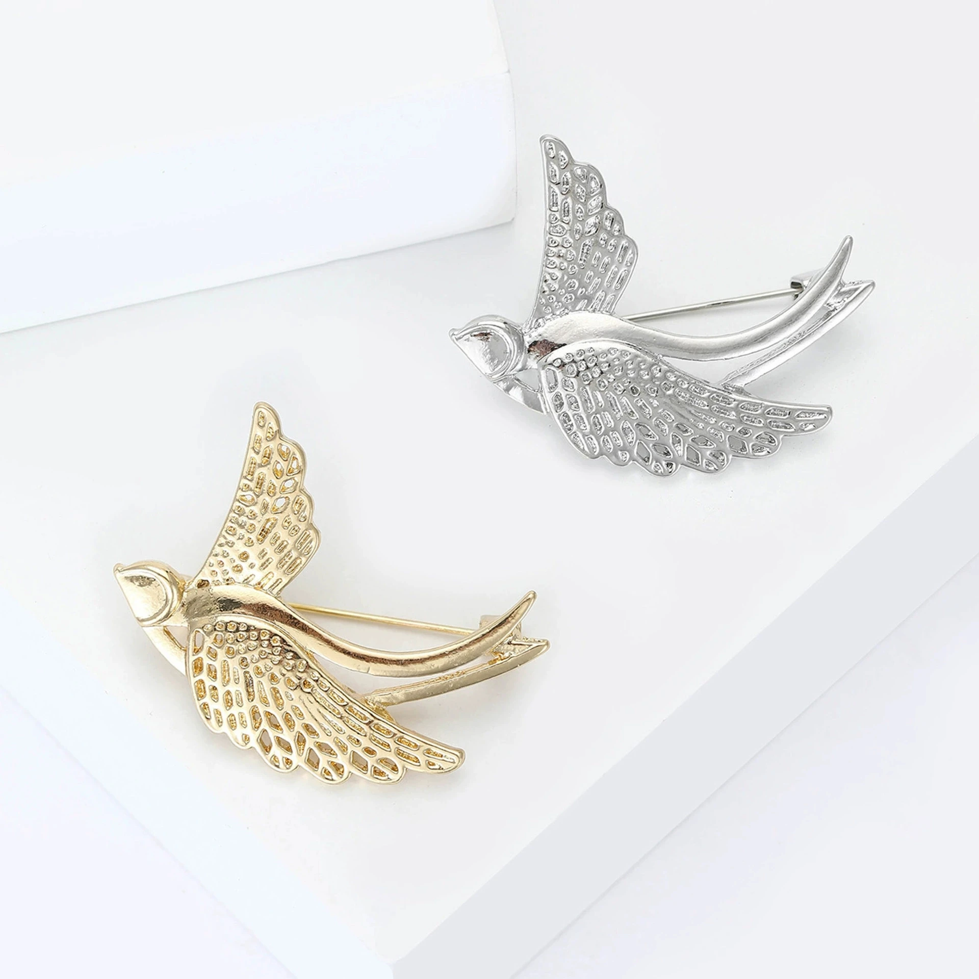 New enamel smooth hollow swallow brooch, fashionable and versatile women's clothing chest flower accessory