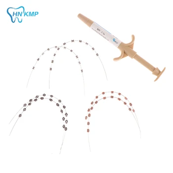 Tymczasowa dekoracja zębów z metalowymi przewodami Kolorowy metalowy wspornik i ligaturą ortodontyczną z klejem do utwardzania światłem dentystycznym