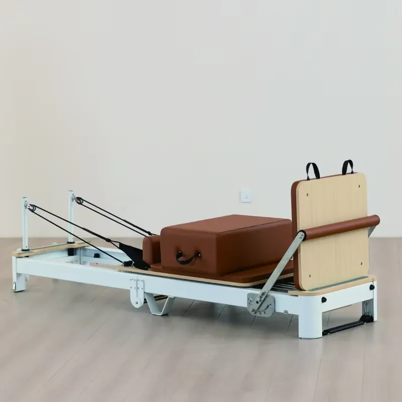 Space-Saving Folding Aluminum Pilates Reformer Designed for Urban Home Gyms and Boutique Studios