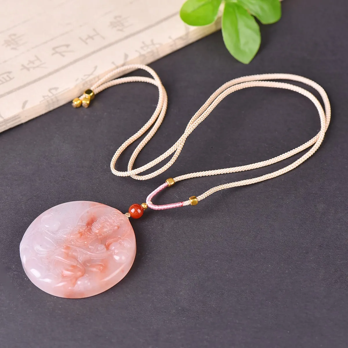 

The exquisite peach blossom jade Guanyin symbolizes the compassion of saving all beings and is a perfect gift for family
