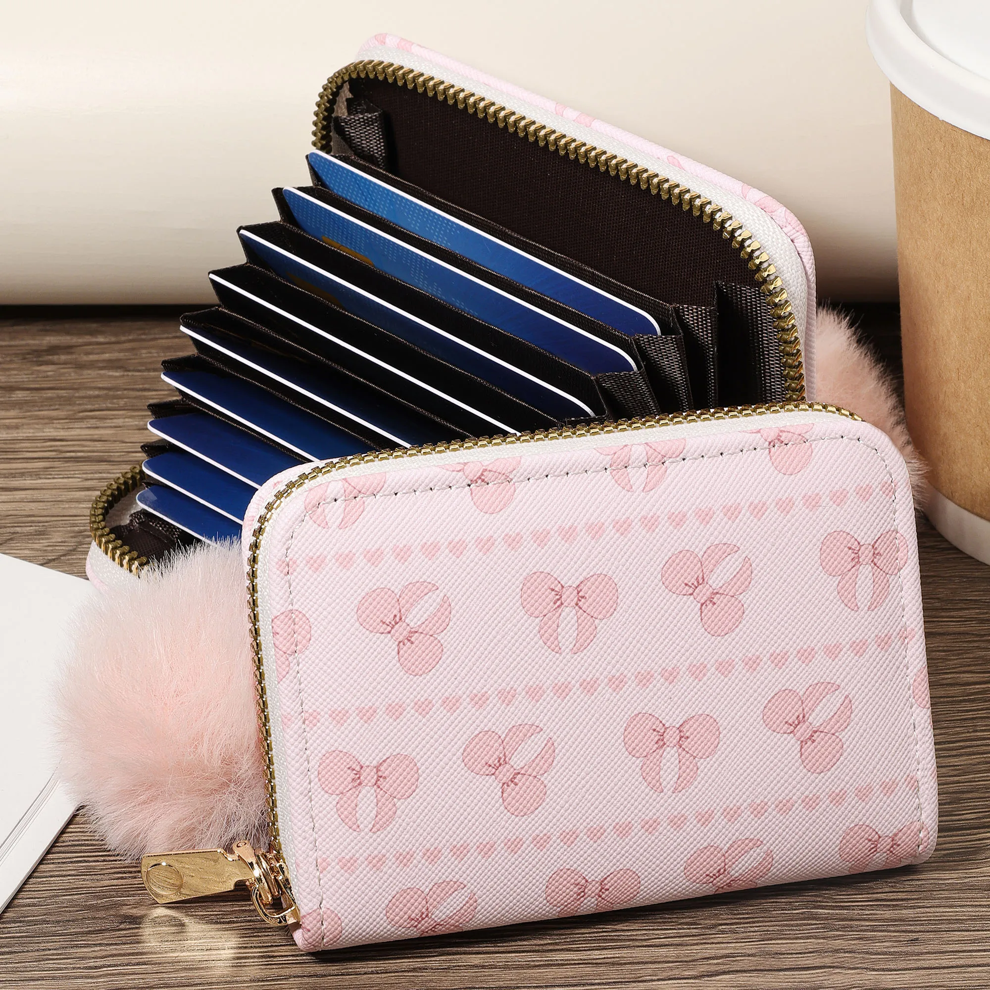 Fashionable credit card storage bag, easy to carry with multiple compartments. Adorned with a Delicate Pom pom, perfect for outd