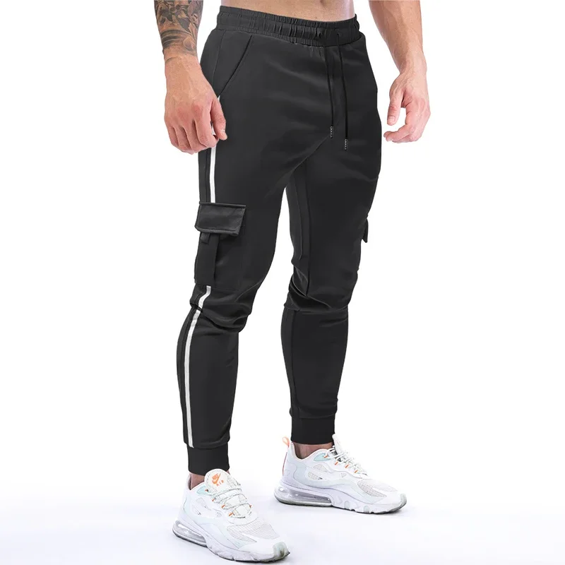 Pantaloni sportivi elastici da uomo pantaloni Casual pantaloni da Jogging traspiranti da uomo pantaloni sportivi da corsa ad asciugatura rapida abbigliamento uomo Streetwear