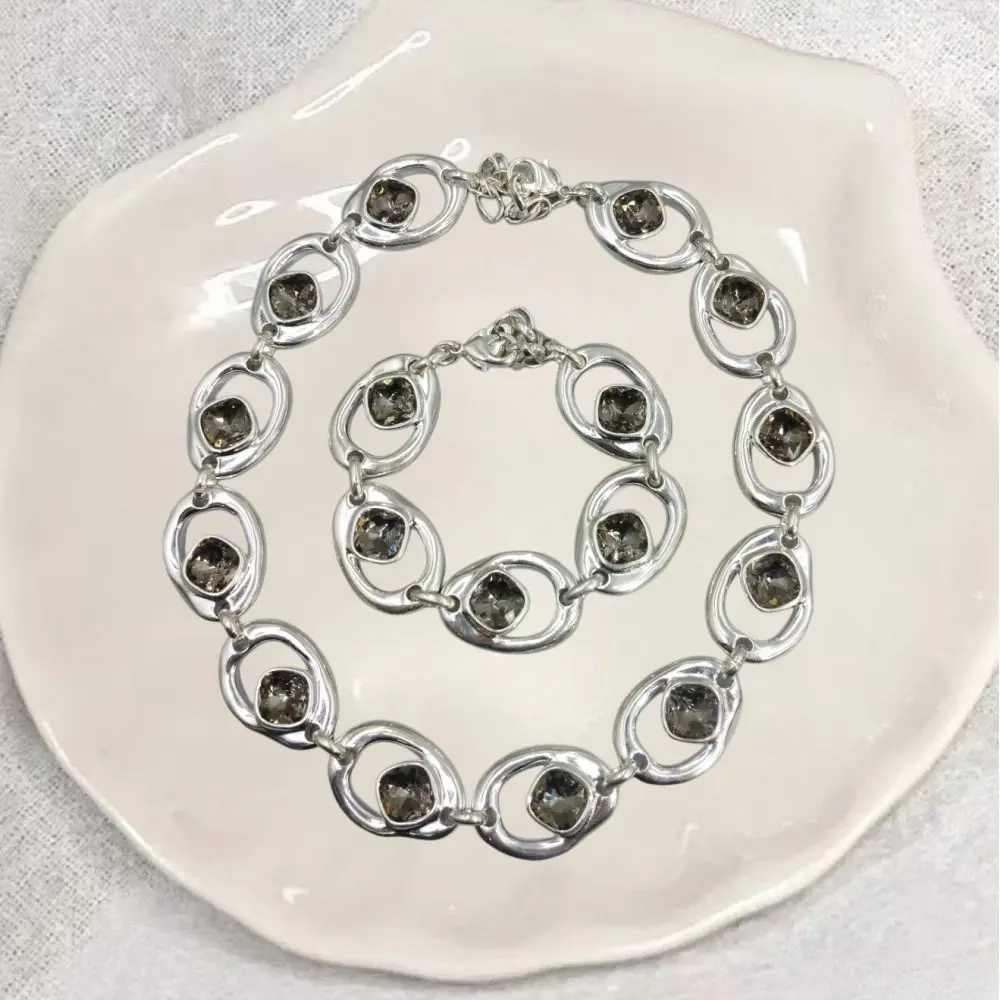 

2026 Spring Bright Mature Gold Silver Elliptical Ring Grey Crystal Bracelet Necklace Jewelry Two Piece Set Banquet Gift