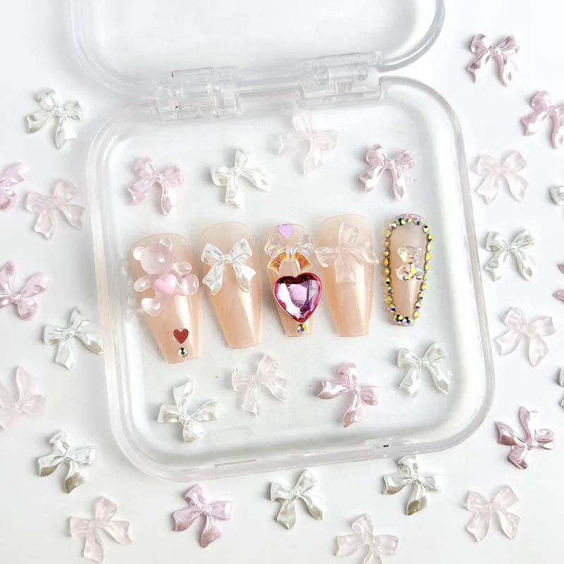 ピンクの氷のように透明なリボンボウネイルアートアクセサリー、光沢のあるボウコンテ樹脂ネイルチャーム、DIYマニキュアデザインネイルデコレーションパーツ