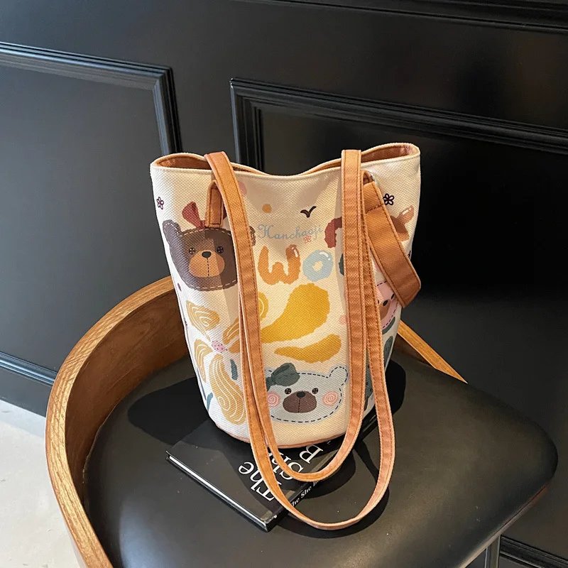 

Autumn and Winter Large-capacity Bucket Female Cute Cartoon Canvas Commuter Niche Versatile Single Shoulder Underarm Tote Bag