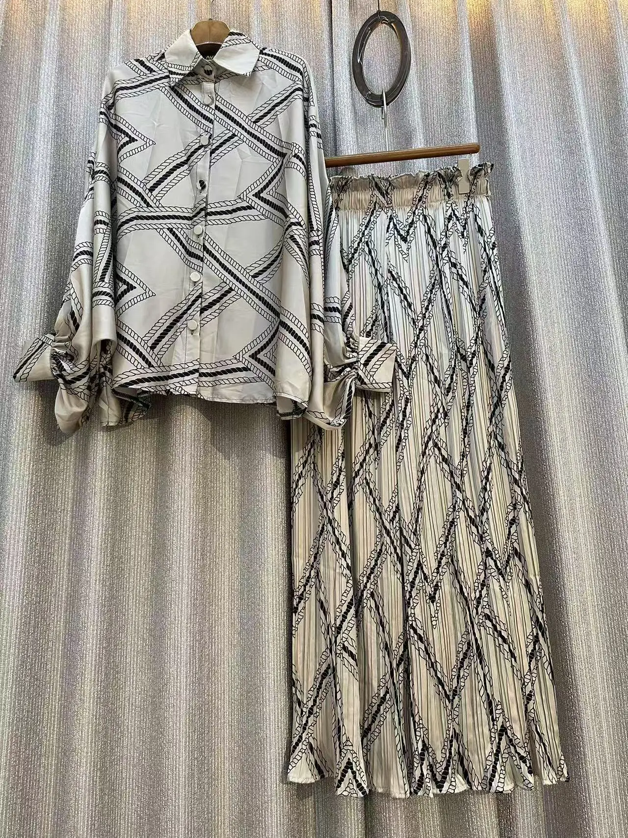 Nieuwe mode elegante 2-delige pak dames ontwerp gevoel vleermuismouwen tops + losse geplooide wijde broek vrouwelijke kleding