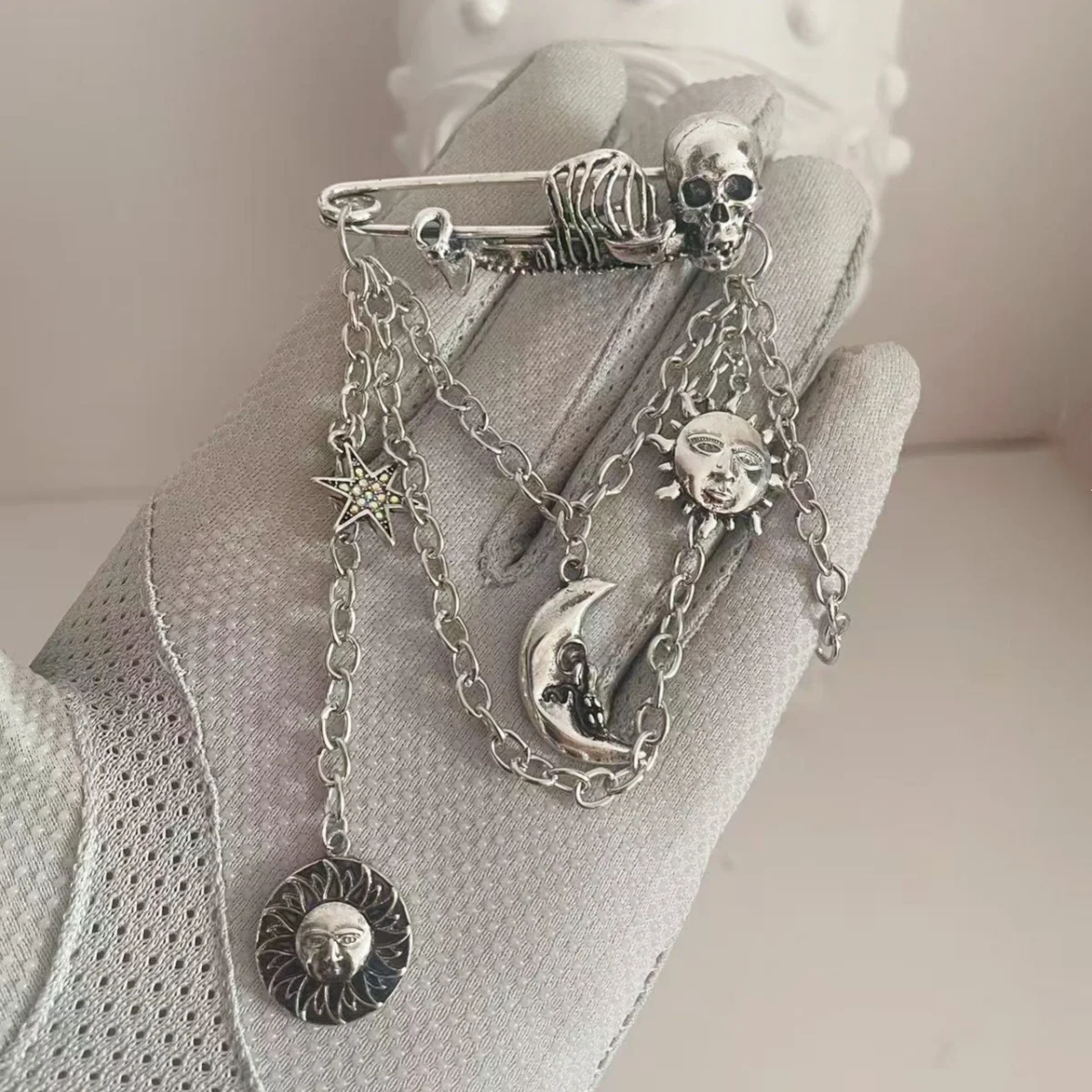 

MITTO FASHION JEWELRIES AND HIGH-END ACCESSORIES SKULL SAFETY PIN HANGING DOWN WITH SUN, MOON, STAR VINTAGE PIN DRESS BROOCH