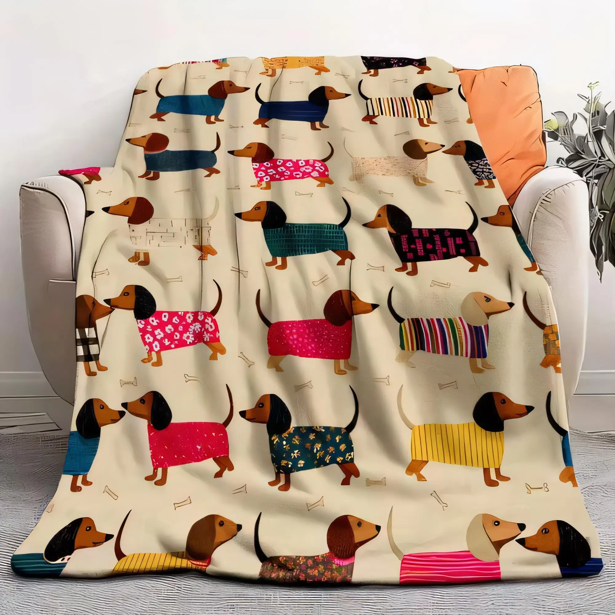 Poltrona bege com cobertor de dachshund de desenho animado – Padrões de cachorro coloridos, roupas fofas, ícones de osso, lance aconchegante – perfeito para viver