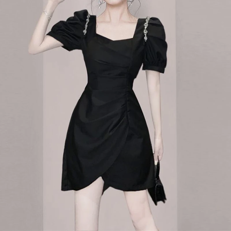 New French dress  summer  2023, with a slim design and a slim waist, small square neck, small black dress