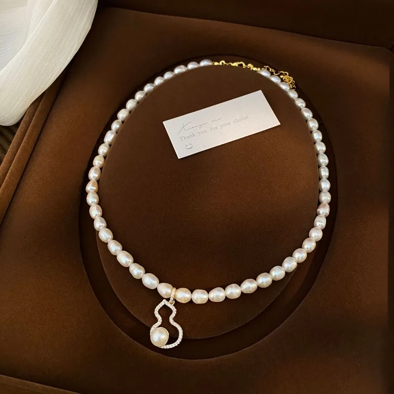 

Dainashi 6-7mm Rice Shape Freshwater Pearl Necklaces AAA Quality 40cm Calabash Pendant Adjustable Necklaces Jewelry Gift