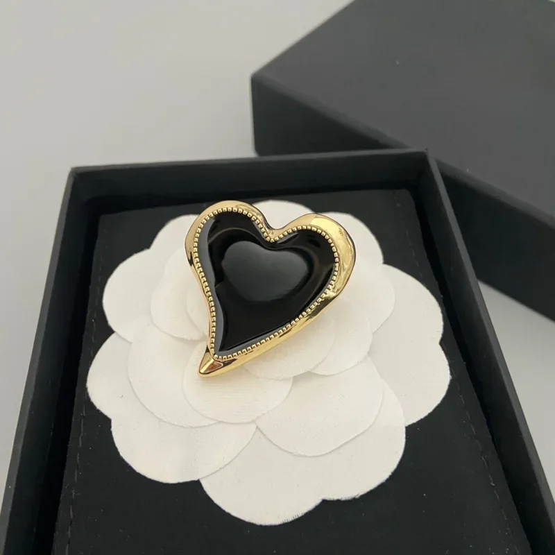 

Black enamel heart brooch