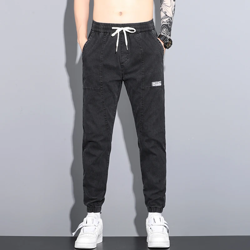 

Новые мужские повседневные тонкие джинсы на весну-лето, свободные рабочие брюки с отворотами, эластичный пояс, удобные, дышащие, в стиле Харлан