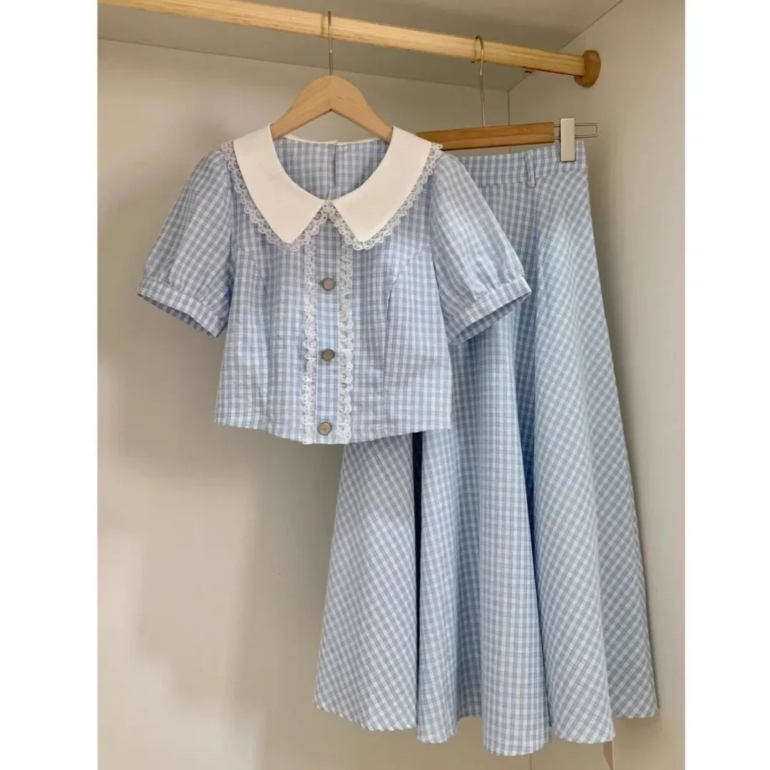 

Children's Blue Plaid Shirt And Half Skirt Two-Piece Set Girl Doll Collar Summer 2026 New Fashionable Kids' Outfit