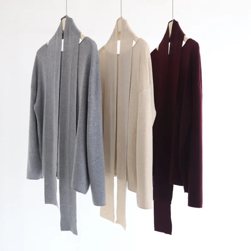 

Women wear a loose long-sleeved knitted sweater pullover with a wool blend atmosphere ribbon belt