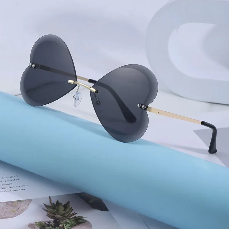 

New listing fashion heart hollow sunglasses (women's rimless) trendy party wave style funny dance sunglasses