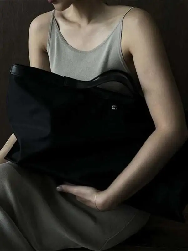 حقيبة كمبيوتر قماشية كبيرة السعة، تصميم جديد لعام 2025، حقيبة حمل للطلاب، حقيبة كتف عادية، حقيبة يد ناعمة قابلة للطي بلون واحد