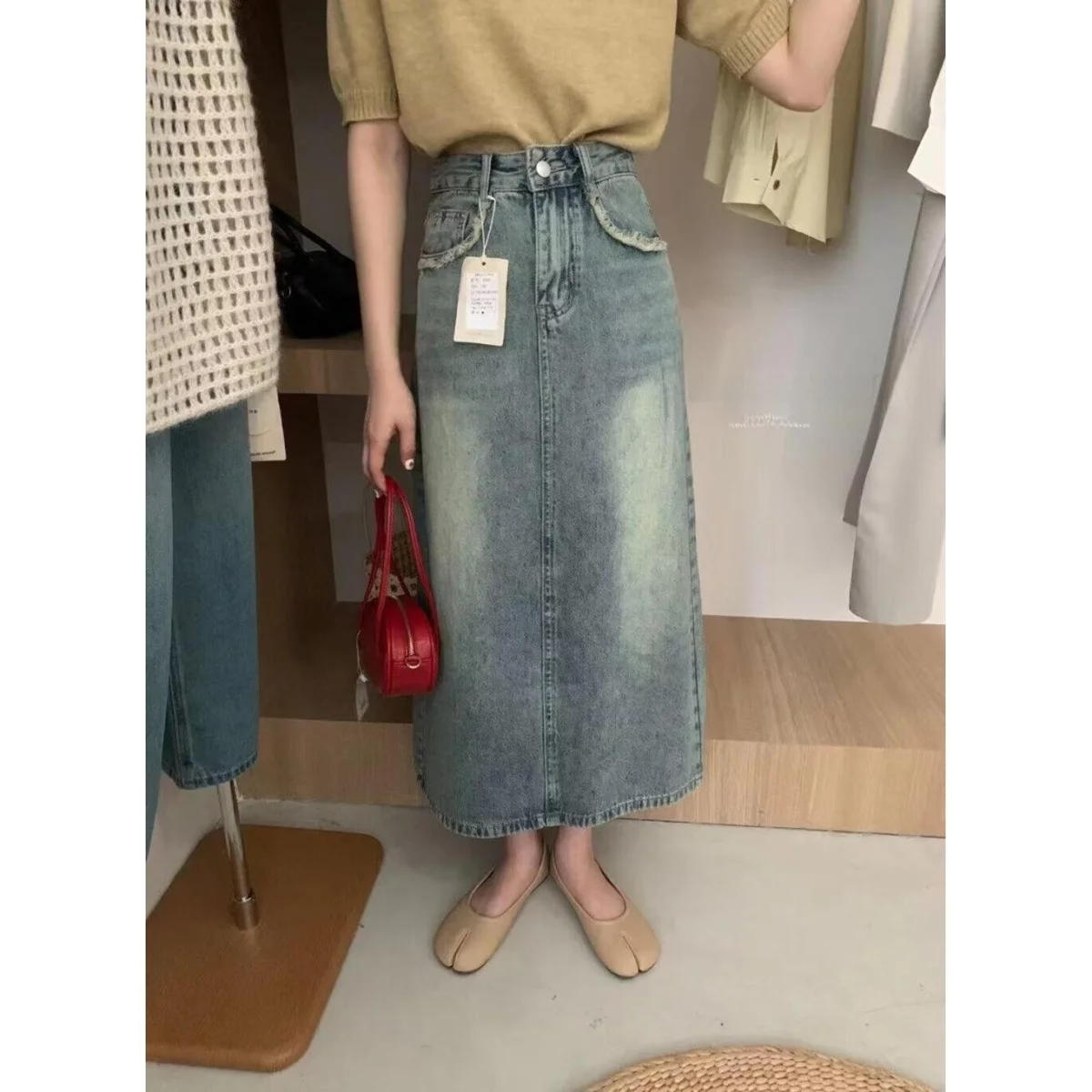 

Женская джинсовая юбка А-силуэта, весна-лето, новый дизайн, утягивающая, с высокой талией, с разрезом, повседневный стиль, с наполнителем из утиного пуха, средняя талия