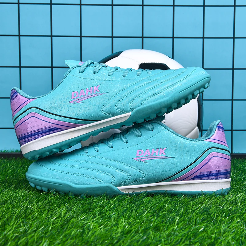 

A pair of children's perforated football shoes with anti-slip and wear-resistant properties, training shoes model HXH-X32-1